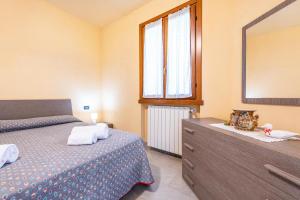 A bed or beds in a room at Casa Caterina con giardino