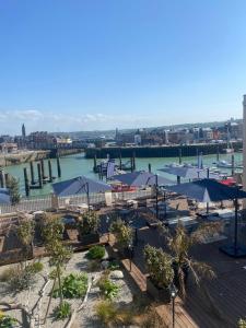 a view of a harbor with boats in the water at LA TOUR AUX CRABES près de la plage in Dieppe