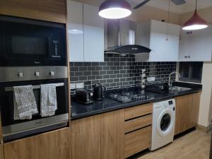 Kuchyň nebo kuchyňský kout v ubytování VaQ Apartments
