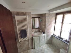 a bathroom with a sink and a mirror at Antico Borgo in Brugnato +54 photos