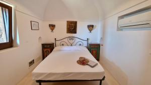 Posteľ alebo postele v izbe v ubytovaní Dammuso Alcyone