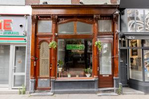 a storefront of a store on a city street at Recharge Hostel in Rotterdam