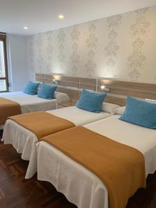 Postel nebo postele na pokoji v ubytování Hostal San Fernando