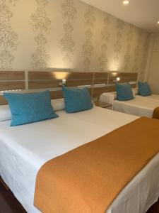 Postel nebo postele na pokoji v ubytování Hostal San Fernando