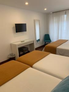 Postel nebo postele na pokoji v ubytování Hostal San Fernando