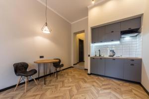 Kuchyň nebo kuchyňský kout v ubytování Secret Apartments