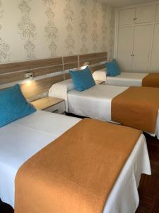 Postel nebo postele na pokoji v ubytování Hostal San Fernando