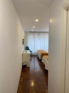 Postel nebo postele na pokoji v ubytování Hostal San Fernando