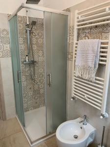 a bathroom with a shower and a sink at La Tortorella in Ginosa +20 photos
