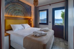 Postel nebo postele na pokoji v ubytování Les Terrasses De Selimiye + 37 fotografií