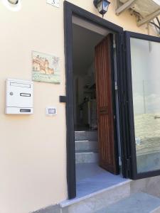 an open door to a room with stairs at A casa di Ro` in Agrigento