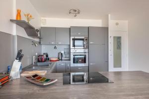 Kuchyňa alebo kuchynka v ubytovaní Vue mer - Appartement face mer pour 6