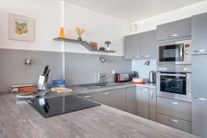 Kuchyňa alebo kuchynka v ubytovaní Vue mer - Appartement face mer pour 6