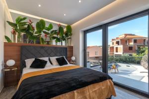 Postel nebo postele na pokoji v ubytování Apartments Aldo + 37 fotografií
