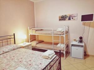 Postel nebo postele na pokoji v ubytování a CASA di CECY