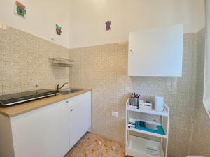 Kuchyň nebo kuchyňský kout v ubytování Guest House Service - Modugno