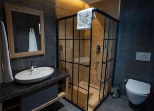 a bathroom with a shower and a sink and a toilet at GÜRSOY EXCLUSIVE HOTEL in Trabzon +18 photos