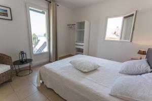 Кровать или кровати в номере La Citadelle Appartements