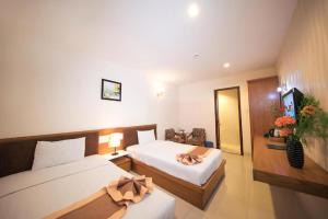 a hotel room with two beds at Valentine Boutique hotel - 29 Bui Vien street in Ho Chi Minh City