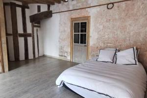 Posteľ alebo postele v izbe v ubytovaní Ancien hôtel particulier avec patio