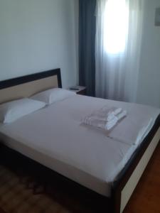 Un ou plusieurs lits dans un hébergement de l'établissement Ksamil Apartments