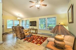 a living room with a couch and chairs and a table at Charming Rural Escape Near Dtwn and Beaches! in Frankfort