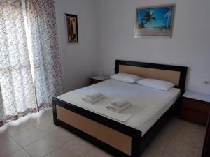 Un ou plusieurs lits dans un hébergement de l'établissement Ksamil Apartments