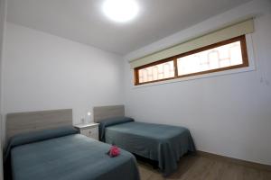A bed or beds in a room at Apartment Discover Las Americas