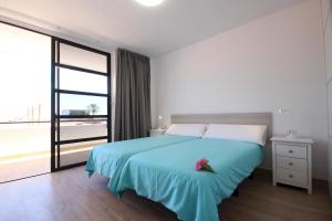 A bed or beds in a room at Apartment Discover Las Americas