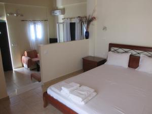 Postel nebo postele na pokoji v ubytování Harmony Villas