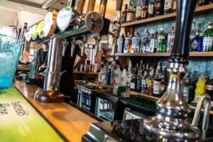 a bar with a lot of bottles of alcohol at Severn View Hotel in Worcester