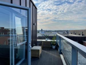 a balcony with a view of the city at Modern & Spacious Penthouse in North London in London
