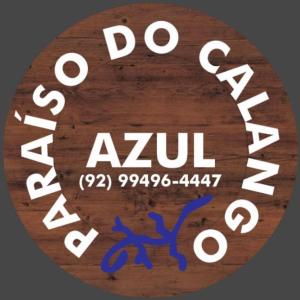 una señal que dice Do Zuqi con escritura azul en Pousada Paraíso do Calango Azul, en Presidente Figueiredo