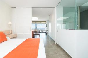 Postel nebo postele na pokoji v ubytování Altos de la Gloria Beach Apartments