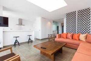 Posezení v ubytování Altos de la Gloria Beach Apartments