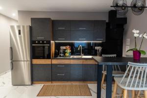 Kuchyň nebo kuchyňský kout v ubytování Muse by the beach with Jakuzzi + 30 fotografií