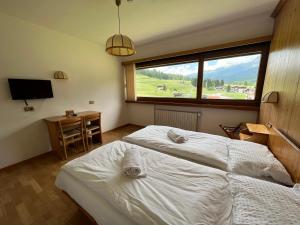 Postel nebo postele na pokoji v ubytování Hotel D'La Varda + 37 fotografií
