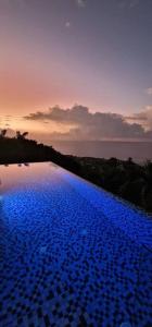 Swimming pool sa o malapit sa Paradise Heights Luxury Apartments & Villa