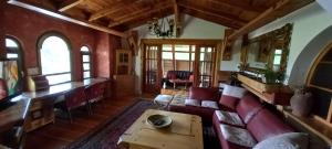 a living room with a couch and a table at Apartments Carevo Polje in Zlatibor