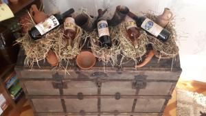 a chest with a bunch of bottles of wine at VILLA TAMARISI in Rokit'i
