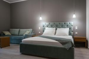 Un pat sau paturi într-o cameră la Erietta Rooms