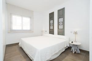 Postel nebo postele na pokoji v ubytování Altos de la Gloria Beach Apartments