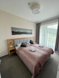 Posteľ alebo postele v izbe v ubytovaní Aparthotel Apartamenty Czarna Góra 320