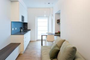 a living room with a couch and a table at Casa Fullin in Belluno