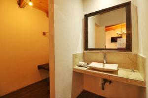 a bathroom with a sink and a mirror at La Escondida Hotel Boutique in Zacatlán +161 photos