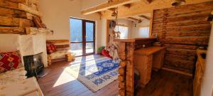 a room with wooden walls and a wooden floor at Casa Bună Fundățica in Fundăţica