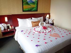 Letto o letti in una camera di Asialink Premier hotel