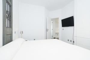 Postel nebo postele na pokoji v ubytování Altos de la Gloria Beach Apartments