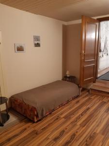 Una cama o camas en una habitación de Appartement Ferienwohnung LANG