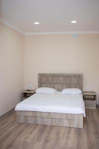 Postel nebo postele na pokoji v ubytování Spitak tun